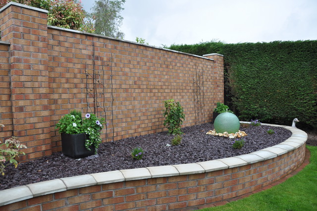 Wall constructed with decorative facing brick to match property