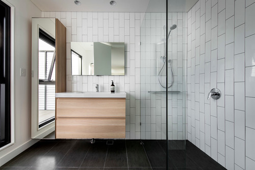 bathroom with white vertical subway tile
