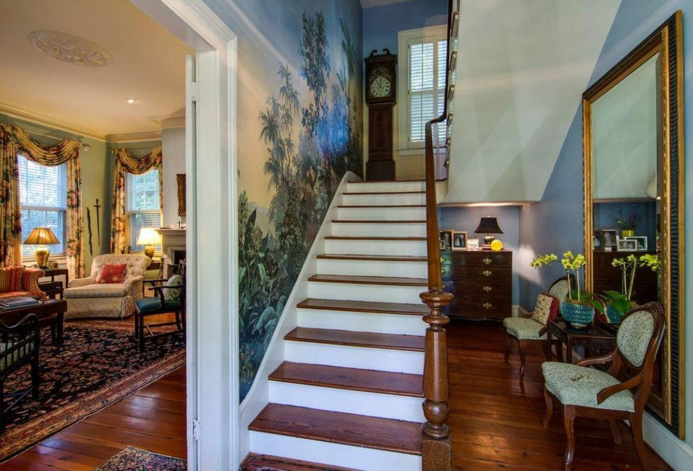 Design ideas for a large traditional foyer in Charleston with blue walls and medium hardwood floors.