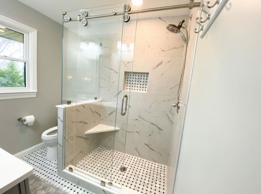 Photo of a small contemporary master bathroom in Philadelphia with shaker cabinets, grey cabinets, an open shower, a two-piece toilet, gray tile, ceramic tile, grey walls, ceramic floors, an undermount sink, quartzite benchtops, white floor, a sliding shower screen, white benchtops, a shower seat, a double vanity and a freestanding vanity.