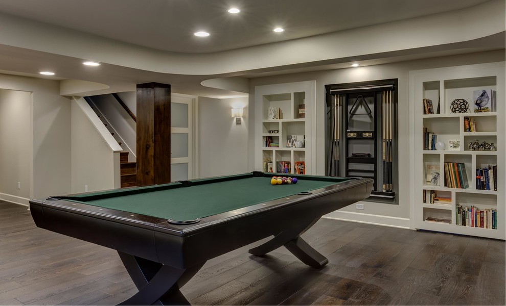 Photo of an expansive contemporary look-out basement in Denver with grey walls, dark hardwood floors, a ribbon fireplace, a tile fireplace surround and brown floor.