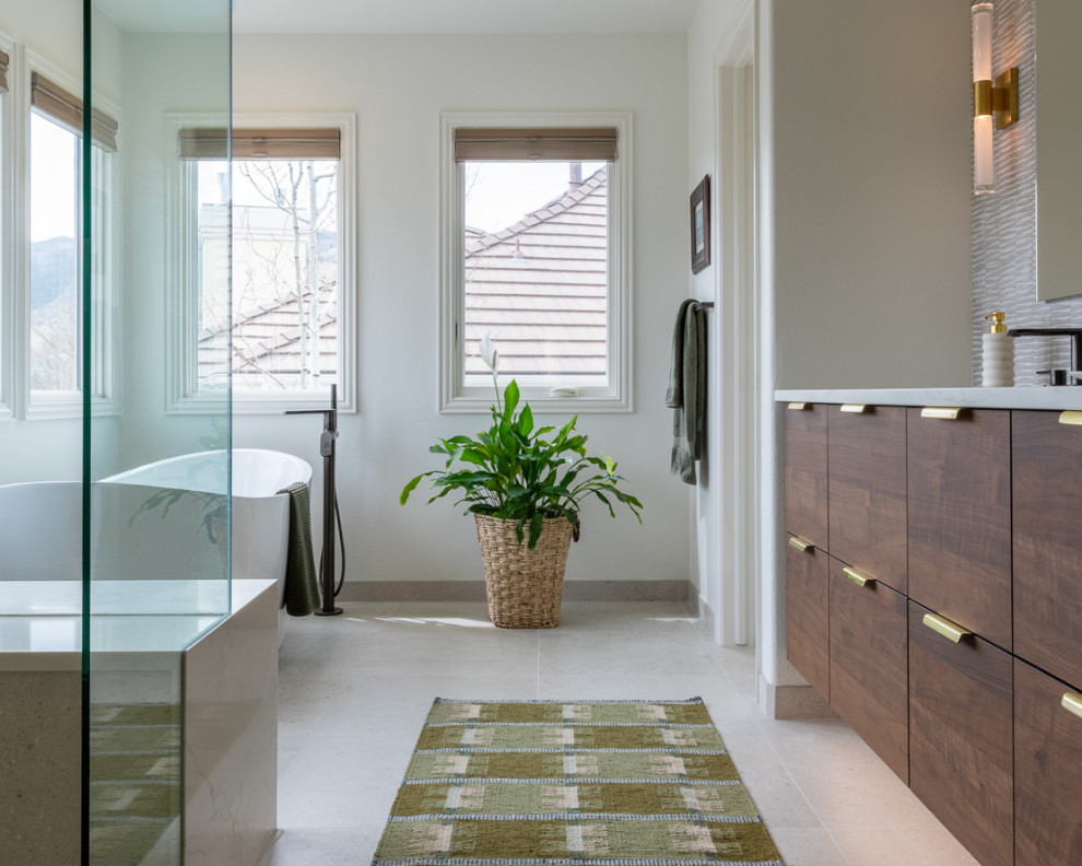 Freestanding bathtub - mid-sized transitional master beige tile and porcelain tile porcelain tile, beige floor and double-sink freestanding bathtub idea in Denver with dark wood cabinets, a two-piece toilet, white walls, an undermount sink, quartz countertops, a hinged shower door, white countertops and a floating vanity