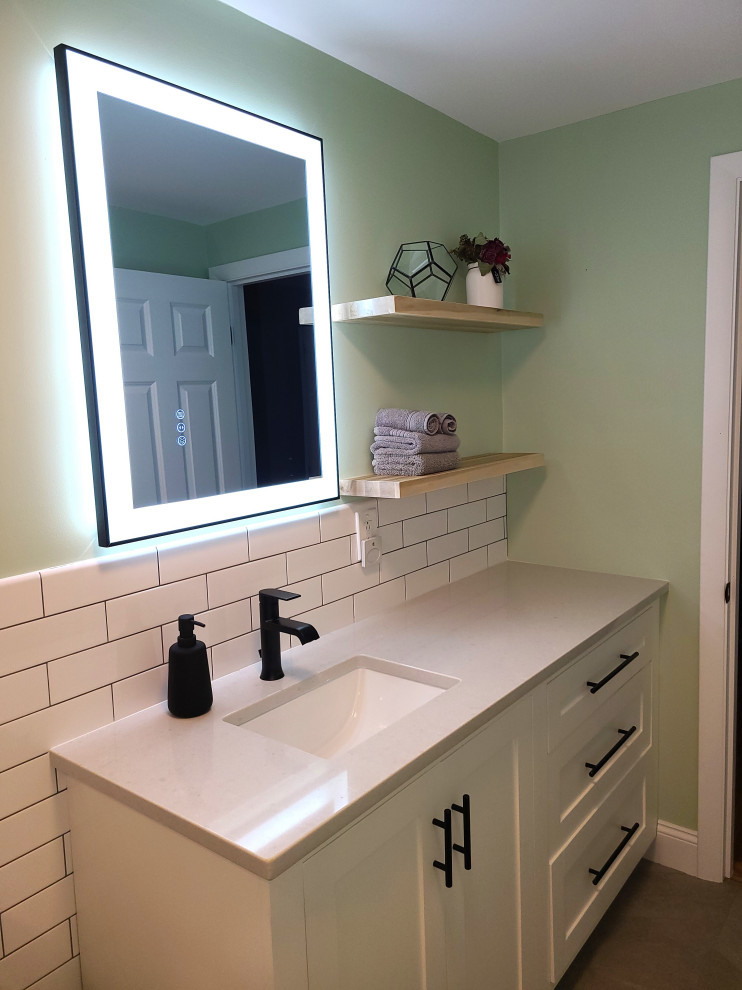 Mid-sized country 3/4 bathroom in Boston with raised-panel cabinets, white cabinets, an open shower, white tile, subway tile, green walls, porcelain floors, an undermount sink, grey floor, a sliding shower screen, brown benchtops, a single vanity and a built-in vanity.