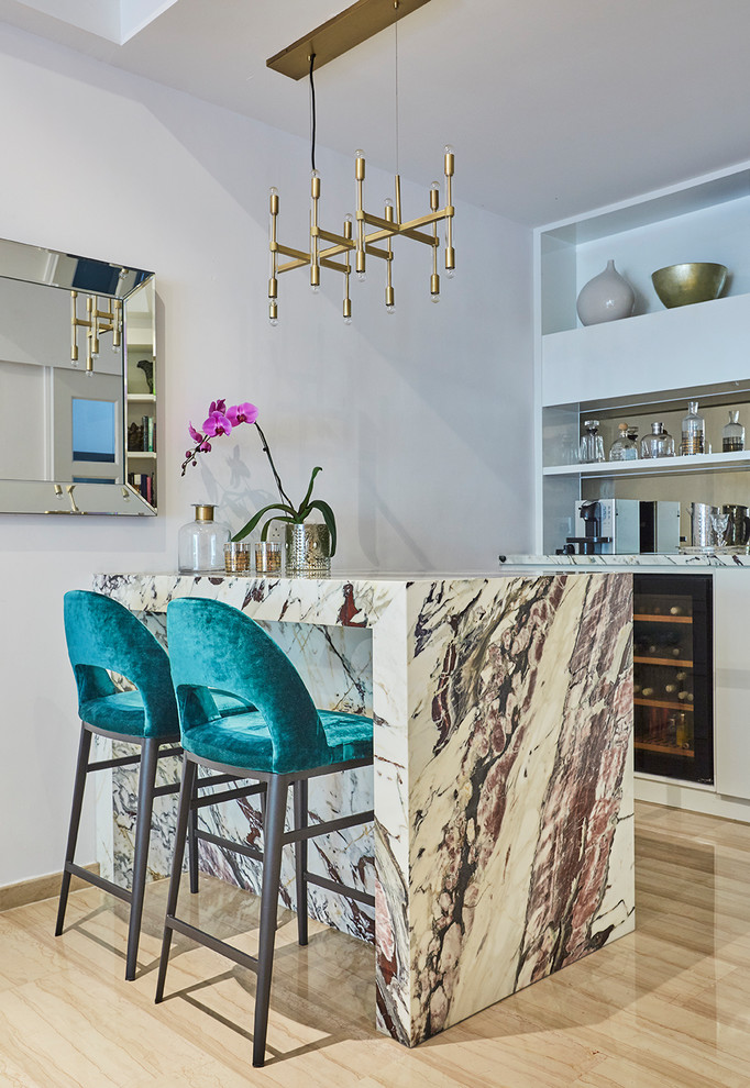Inspiration for a contemporary seated home bar in Singapore with open cabinets, white cabinets, light hardwood floors, beige floor and multi-coloured benchtop.