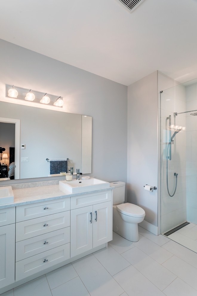 Mid-sized traditional master bathroom in Vancouver with shaker cabinets, white cabinets, an alcove shower, a two-piece toilet, white tile, ceramic tile, grey walls, ceramic floors, a vessel sink, laminate benchtops, white floor, white benchtops, an open shower, a double vanity and a built-in vanity.