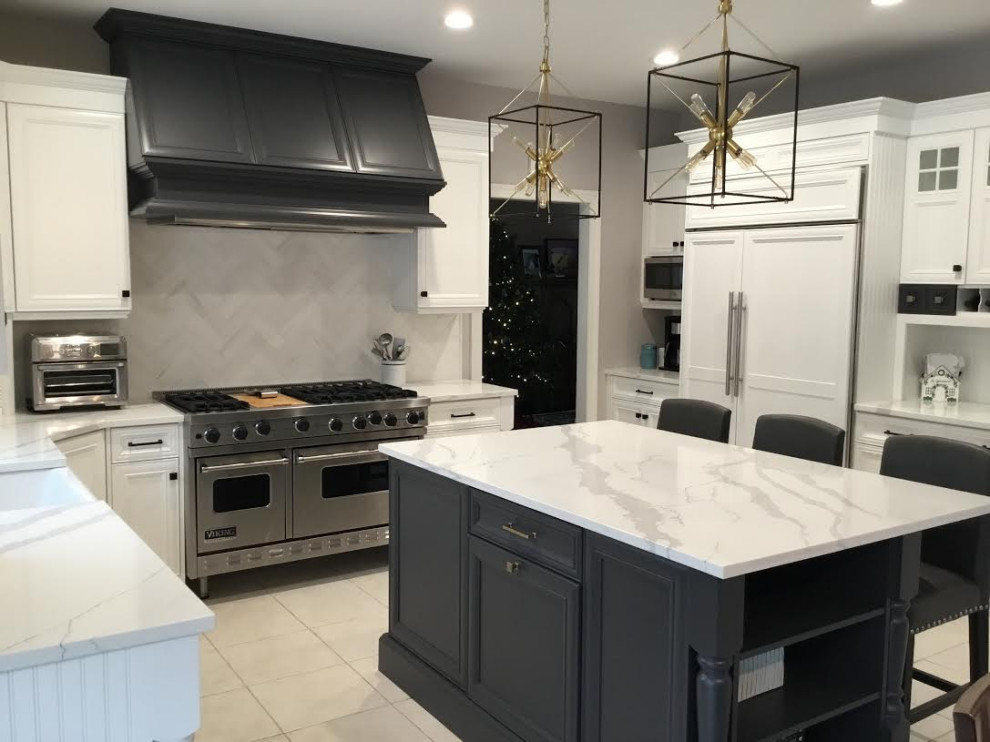 A Transitional Kitchen with a gorgeous Herringbone marble backsplash