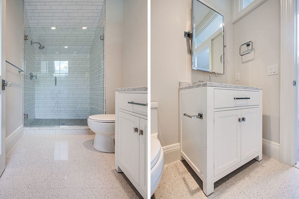 Large transitional master marble floor and white floor freestanding bathtub photo with recessed-panel cabinets, white cabinets, white walls, an undermount sink and a hinged shower door