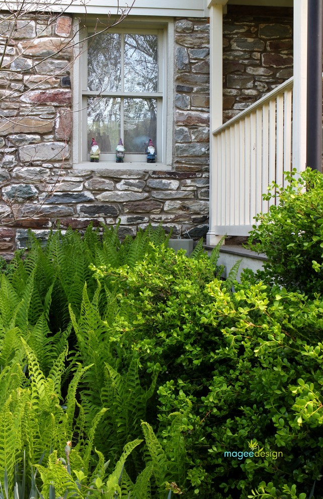 Design ideas for a large rustic drought-tolerant and partial sun backyard stone landscaping in DC Metro for spring.