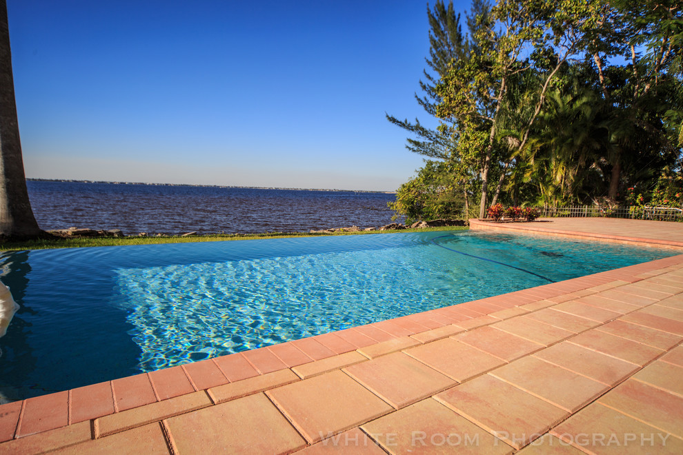 Example of a huge transitional backyard rectangular pool design