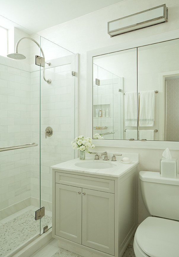 Brooklyn Townhouse - Inspiration for a small transitional corner shower remodel in New York with white walls, an undermount sink and marble countertops