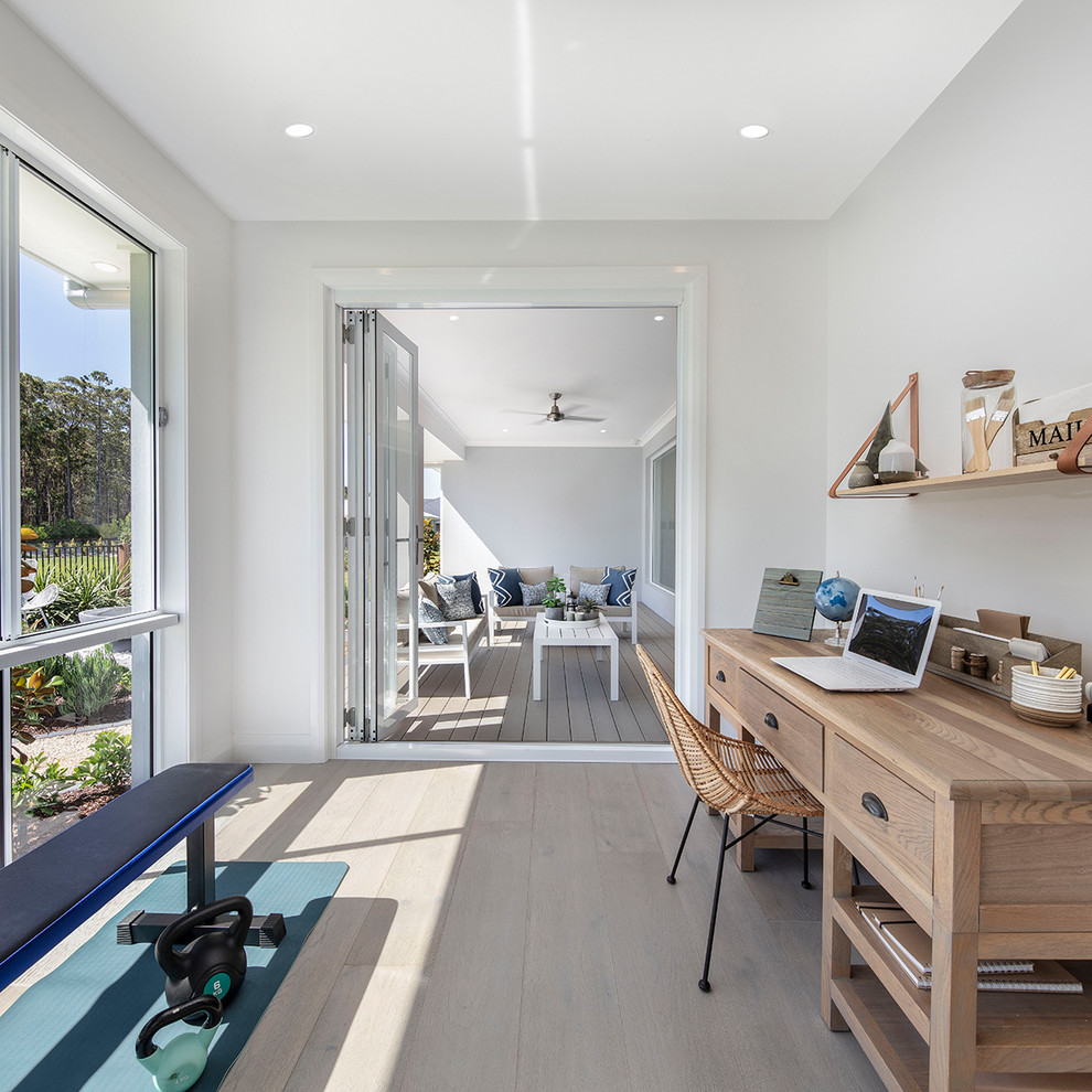 Design ideas for a beach style home office in Sydney.