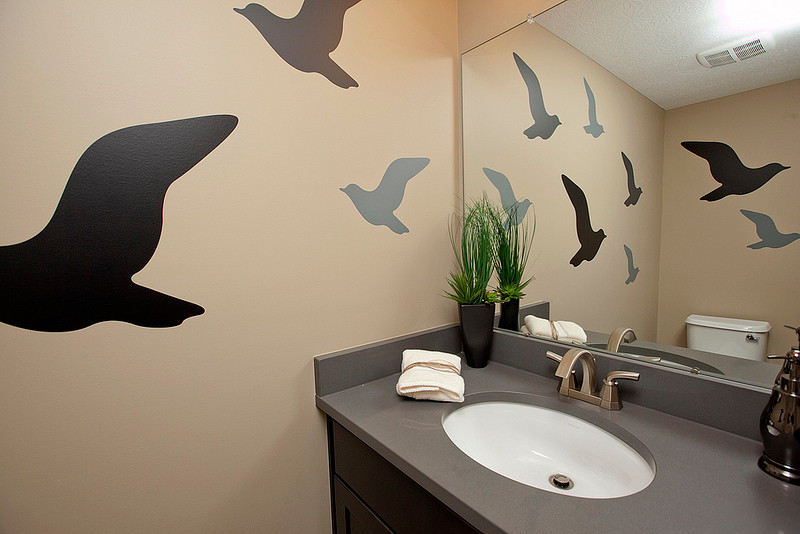 This is an example of a transitional powder room in Columbus.