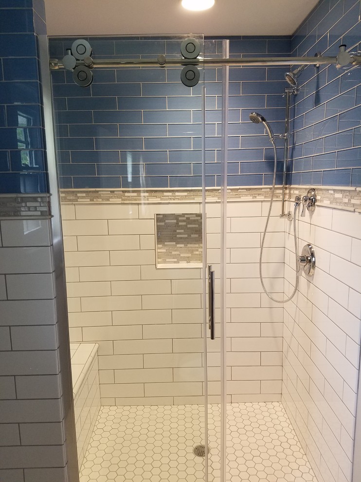 Small transitional 3/4 blue tile and glass tile porcelain tile alcove shower photo in Cincinnati with recessed-panel cabinets, black cabinets, a two-piece toilet, gray walls, an undermount sink and quartz countertops