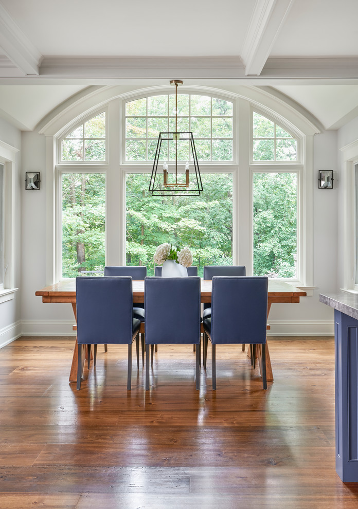 Mid-sized transitional medium tone wood floor dining room photo in Toronto with gray walls and no fireplace