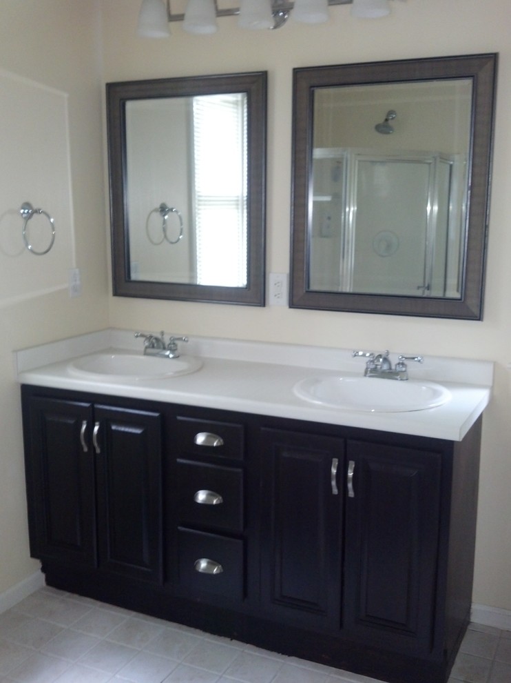 Design ideas for a transitional bathroom in Wilmington with dark wood cabinets.