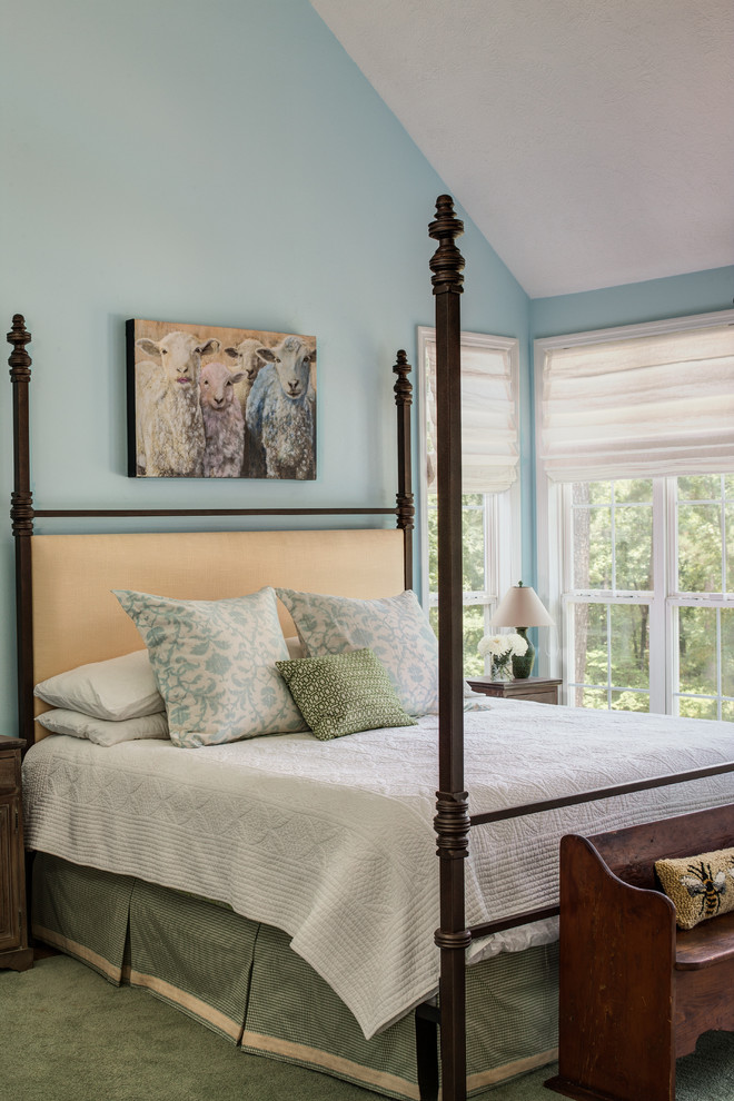 This is an example of a mid-sized transitional master bedroom in Atlanta with blue walls, medium hardwood floors and no fireplace.