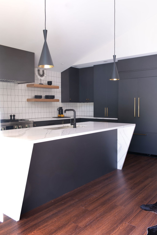 Inspiration for a midcentury eat-in kitchen in Jacksonville with flat-panel cabinets, black cabinets, marble benchtops, ceramic splashback, dark hardwood floors and white benchtop.