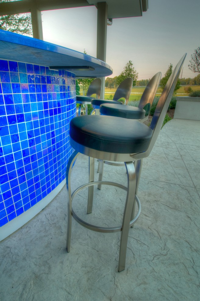 Inspiration for a large transitional backyard concrete paver and rectangular natural hot tub remodel in Cedar Rapids