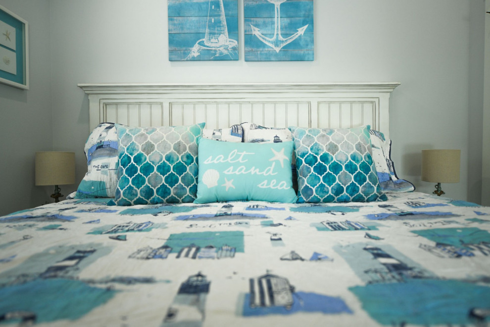This is an example of a beach style bedroom in Tampa.