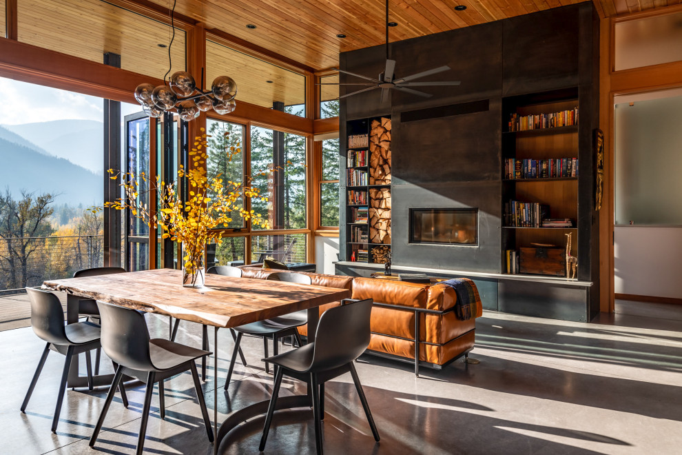 This is an example of a rustic living room in Seattle with a wood ceiling and wood walls.