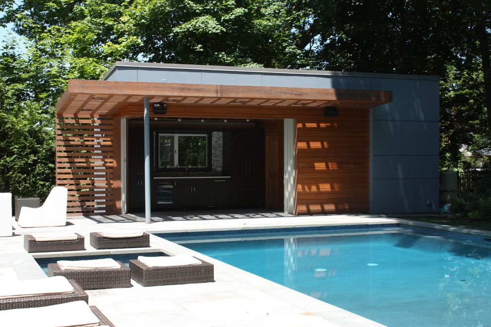 Inspiration for a small contemporary one-storey exterior in New York with concrete fiberboard siding and a flat roof.