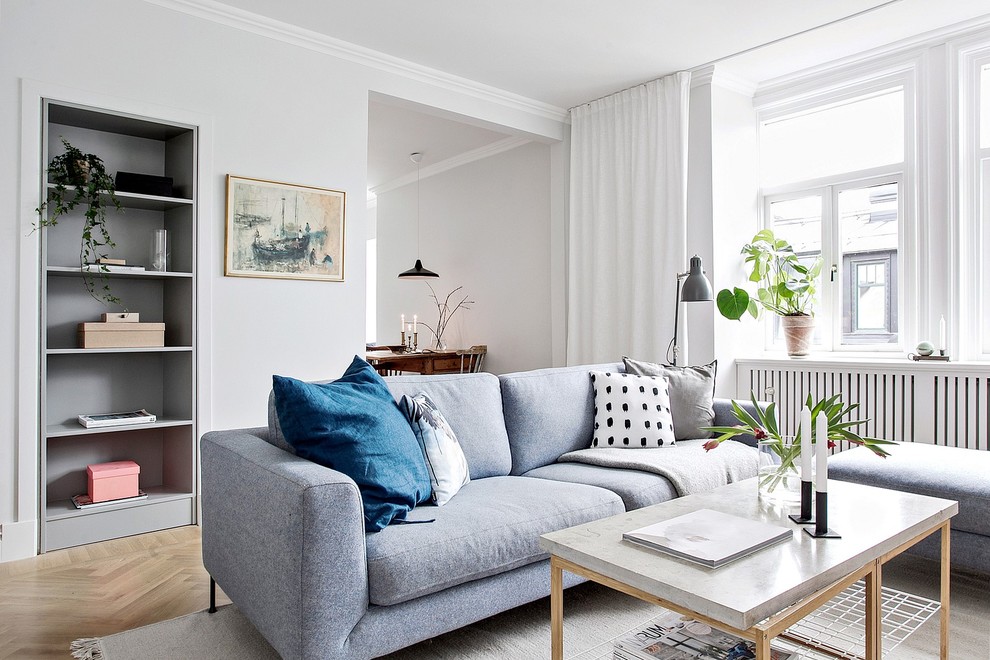 Inspiration for a small scandinavian enclosed living room in Other with white walls, light hardwood floors and beige floor.
