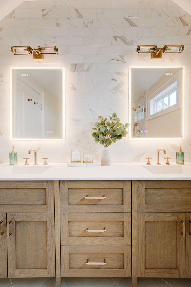 This is an example of a mid-sized beach style master bathroom in Other with multi-coloured tile, marble, porcelain floors, an integrated sink, engineered quartz benchtops, white benchtops, a double vanity, a freestanding vanity, shaker cabinets, medium wood cabinets, grey floor and vaulted.