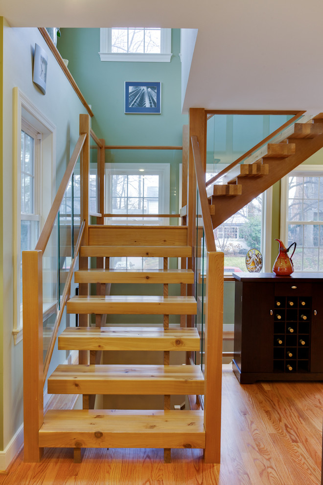 Inspiration for a transitional l-shaped staircase in DC Metro with open risers.