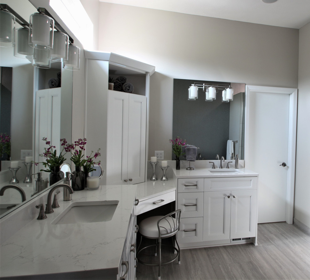 Large transitional master double-sink bathroom photo with white cabinets, an undermount sink, quartz countertops, white countertops and a built-in vanity