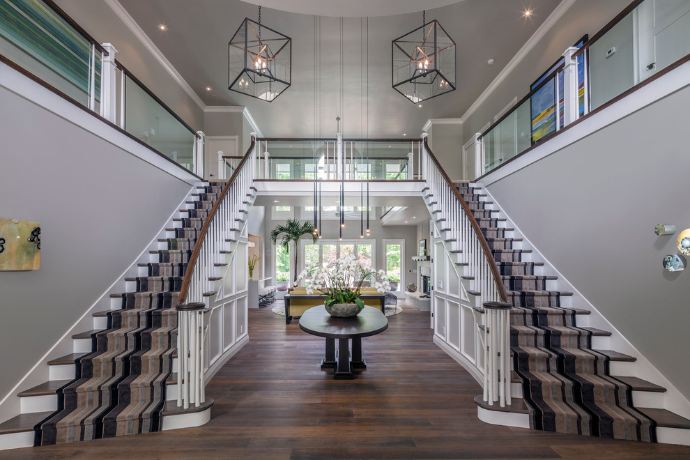 Photo of a large traditional foyer in Sacramento with grey walls and dark hardwood floors.