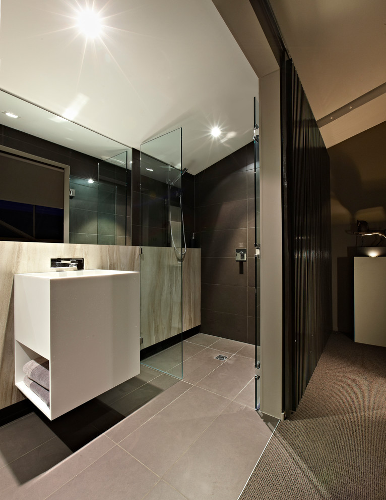 Small contemporary 3/4 bathroom in Melbourne with a console sink, white cabinets, an open shower, a one-piece toilet, gray tile, porcelain tile, grey walls and porcelain floors.