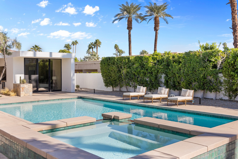 Inspiration for a large transitional backyard concrete and rectangular natural hot tub remodel