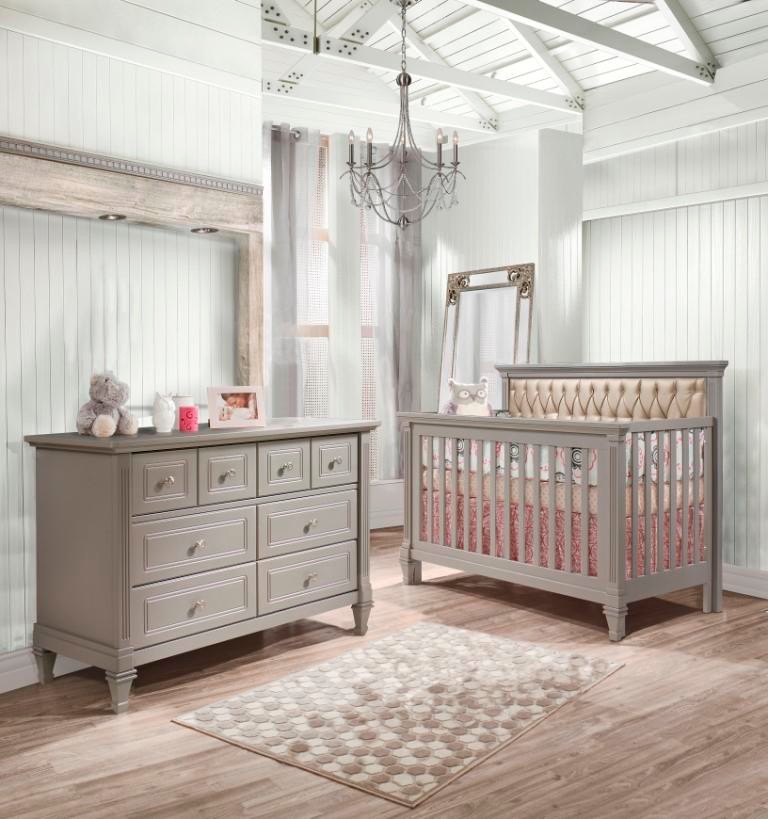 Design ideas for a contemporary gender-neutral nursery in New York with yellow walls and light hardwood floors.