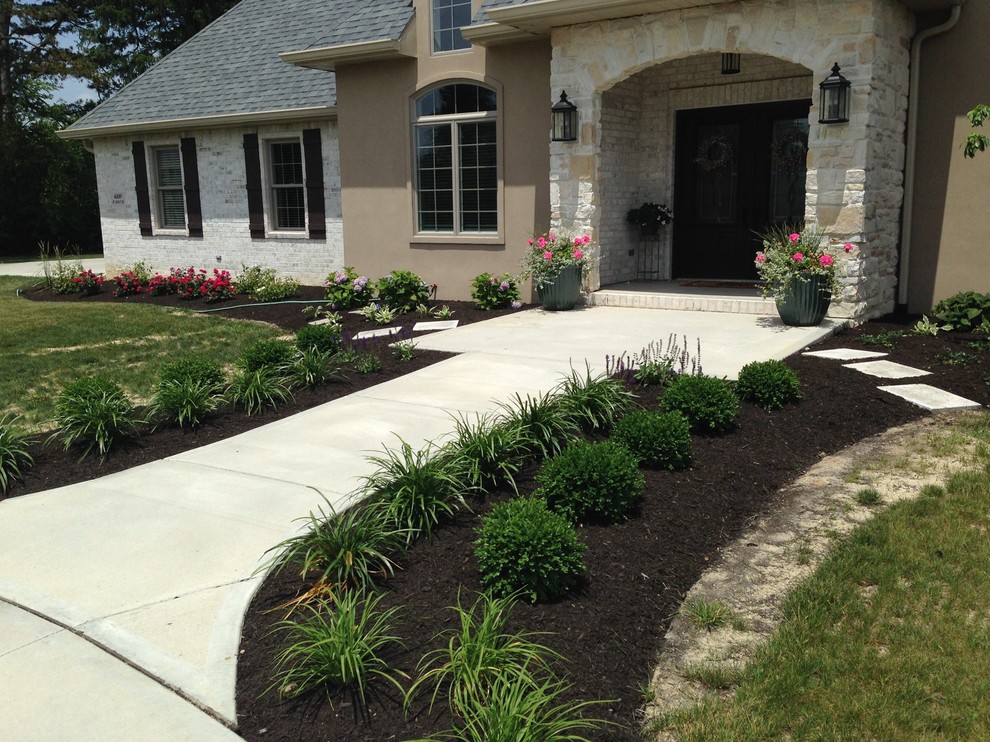 Design ideas for a front yard garden in Indianapolis with a garden path.