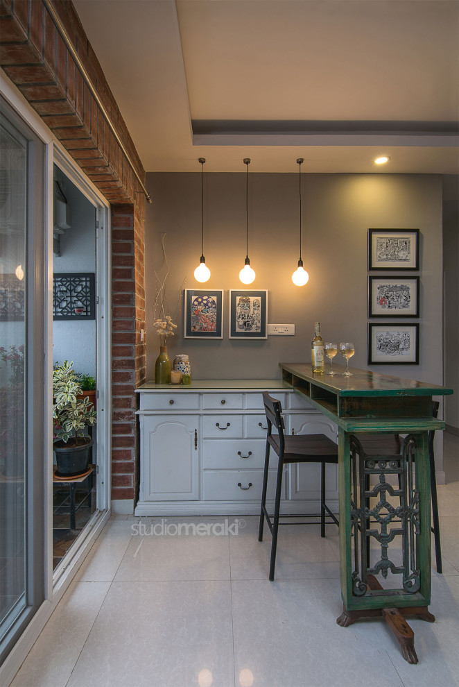 Design ideas for a contemporary home bar in Bengaluru.
