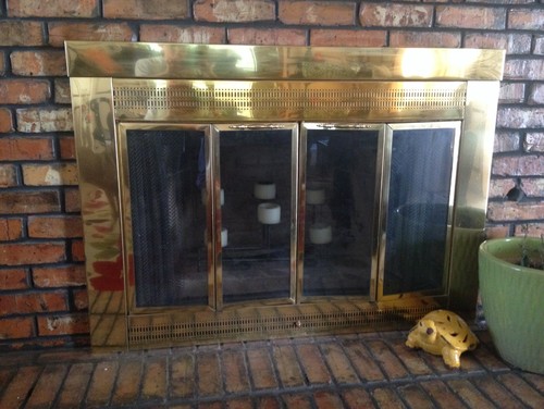 I have this 1980s brass fireplace surround that I