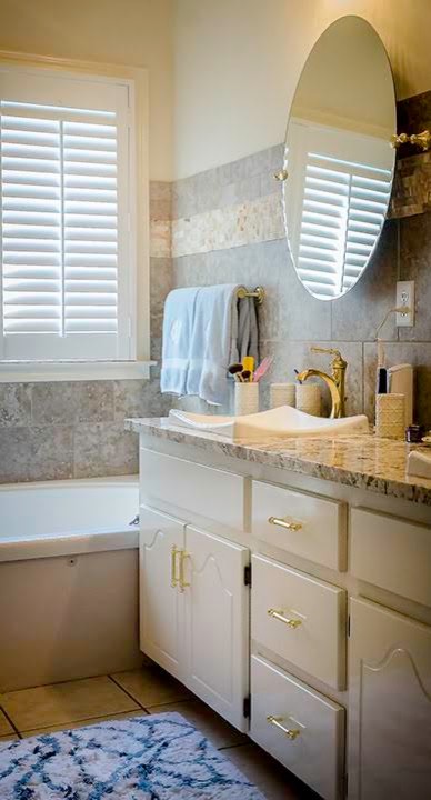 Large transitional master ceramic tile and beige floor drop-in bathtub photo with raised-panel cabinets, beige walls and a drop-in sink