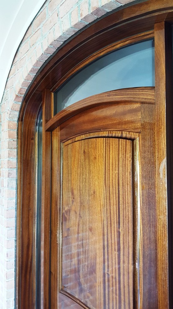 Design ideas for a traditional front door in Other with a single front door and a medium wood front door.
