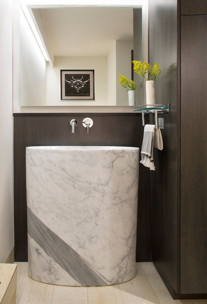 Photo of a contemporary powder room in Denver with an integrated sink.