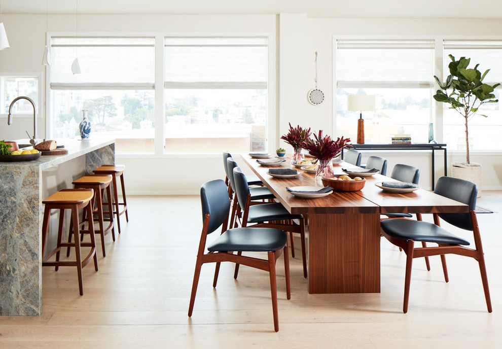 Design ideas for a contemporary open plan dining in San Francisco with white walls and light hardwood floors.
