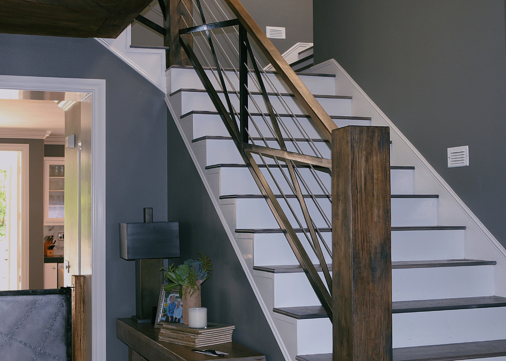 Inspiration for a large contemporary concrete l-shaped staircase in Orange County with painted wood risers.