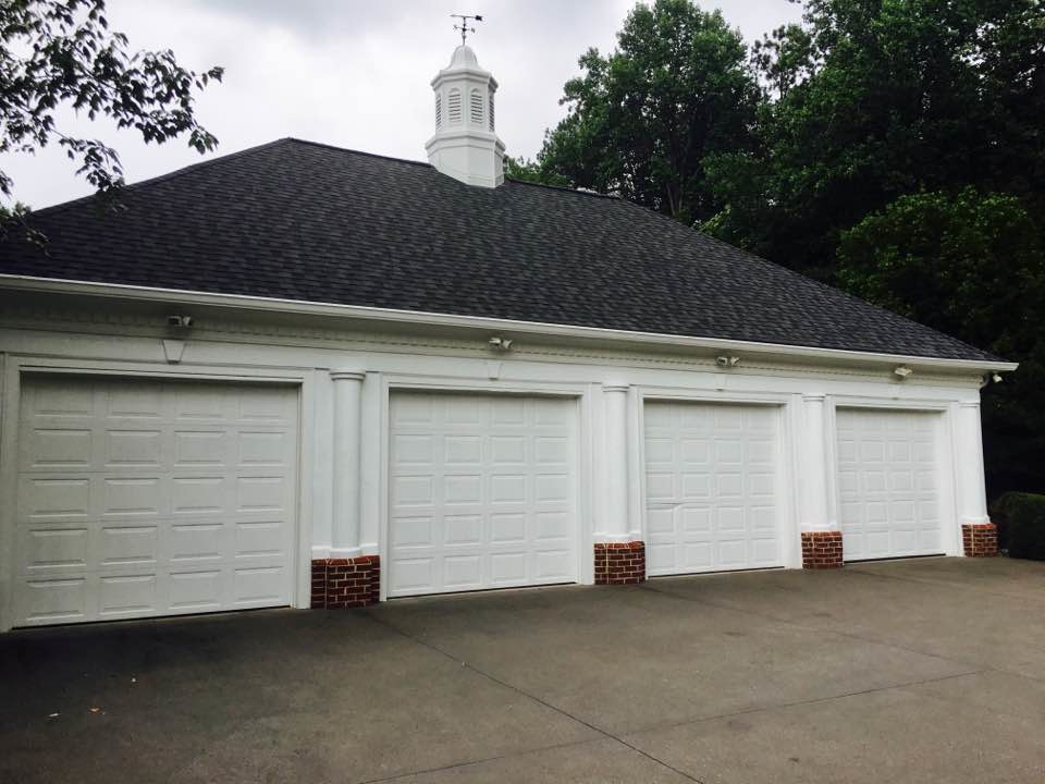 Design ideas for a large traditional detached four-car garage in Atlanta.