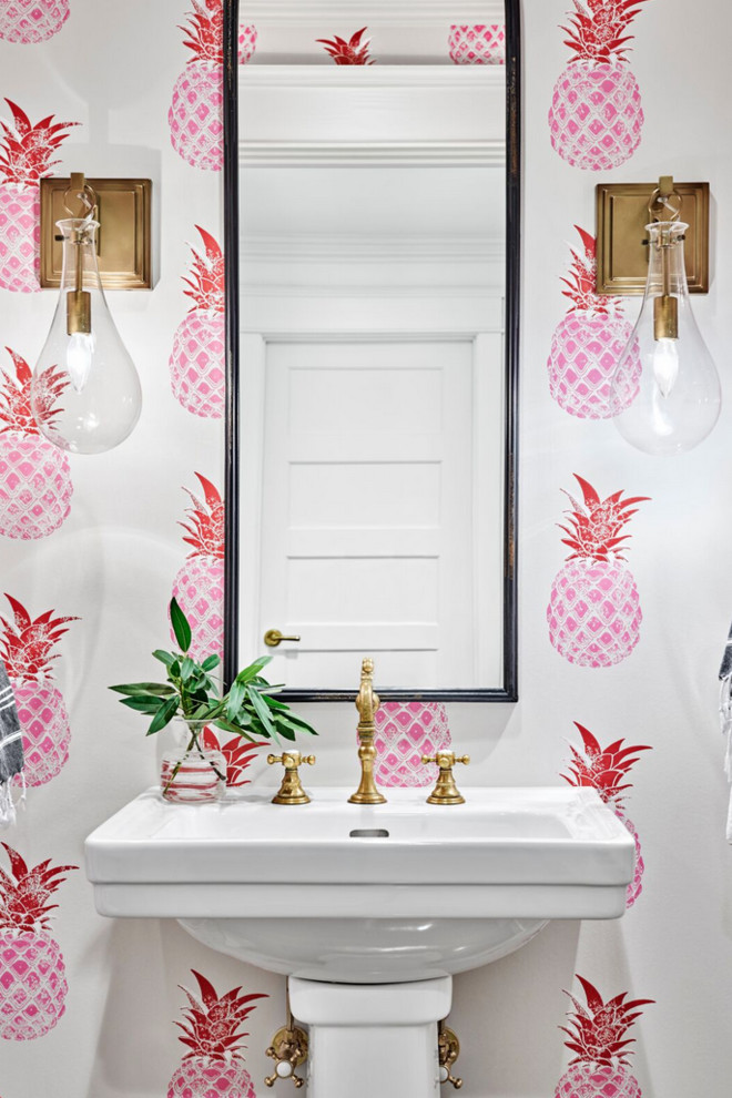 Beach style powder room in Nashville with multi-coloured walls and a pedestal sink.