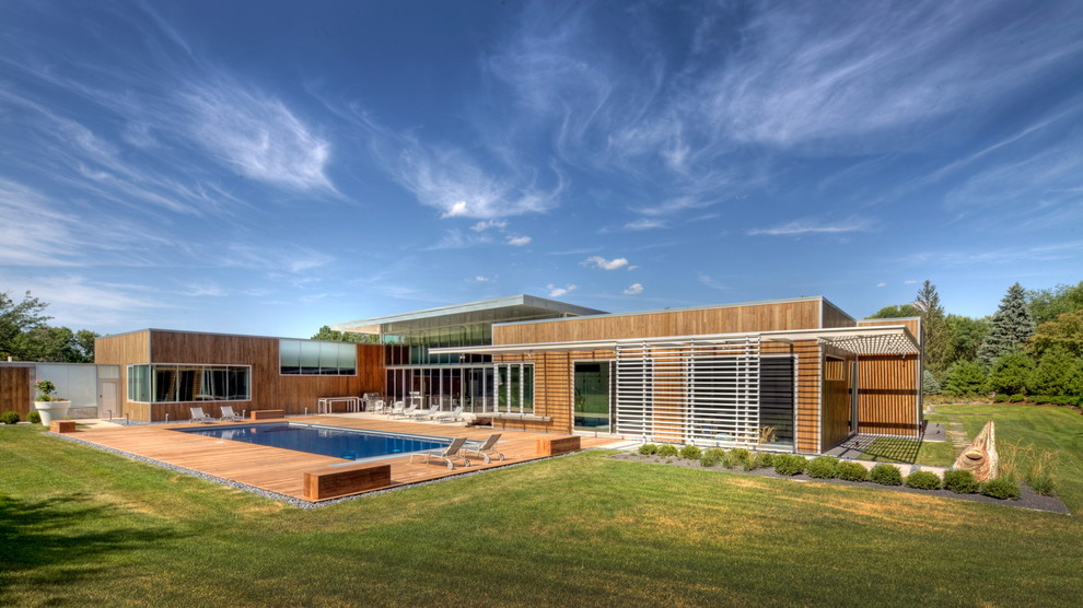 This is an example of a contemporary exterior in Omaha with wood siding.