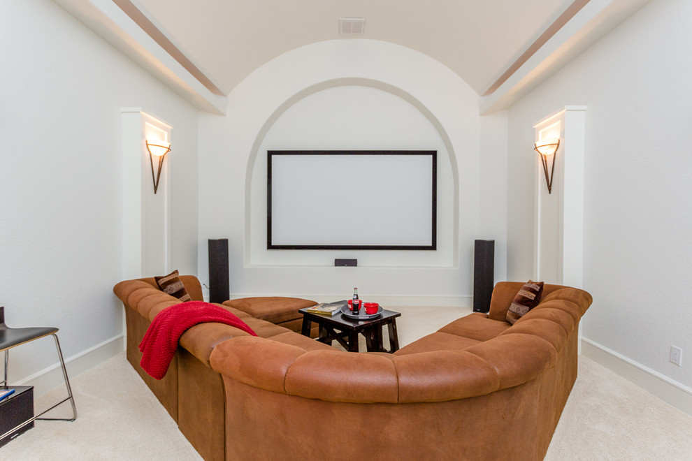 Inspiration for a large mediterranean enclosed home theatre in Houston with white walls, carpet, a projector screen and beige floor.