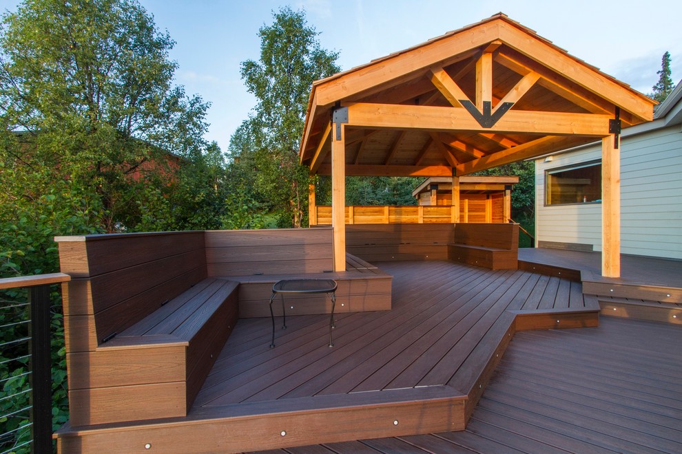 Design ideas for an expansive modern backyard deck in Other with a fire feature and a pergola.
