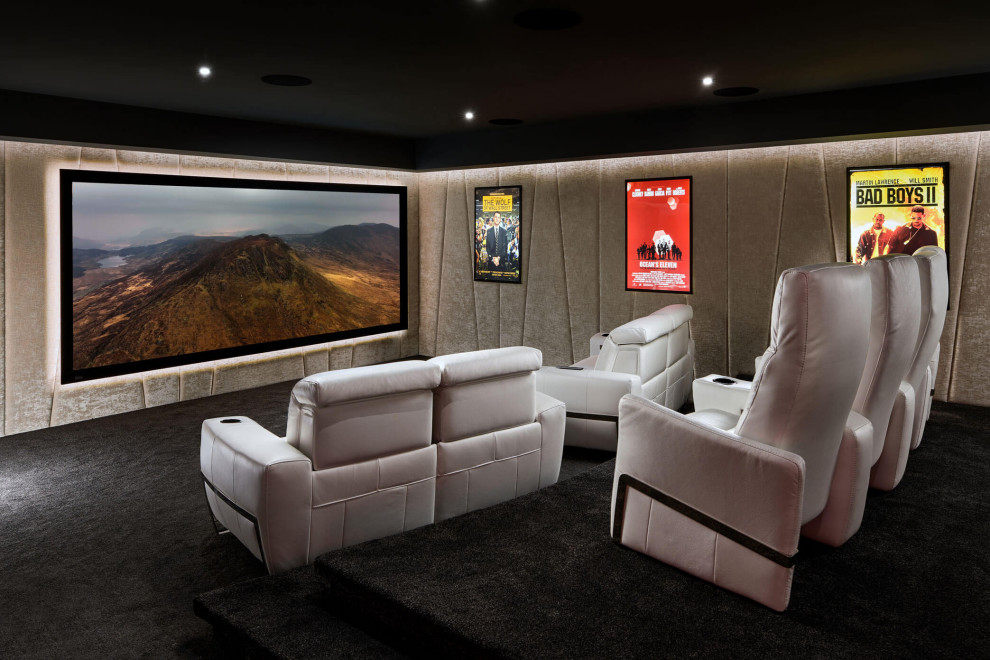 This is an example of a large modern enclosed home theatre in Other with grey walls, carpet, a projector screen and grey floor.