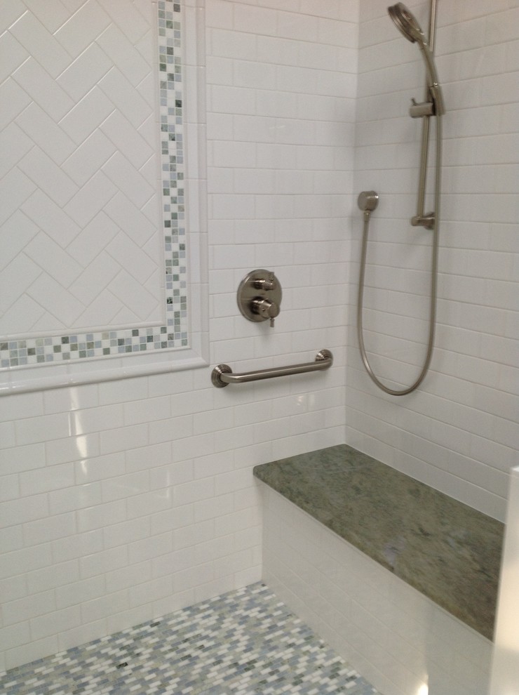 This is an example of a traditional master bathroom in Boston with an alcove shower, white tile and subway tile.