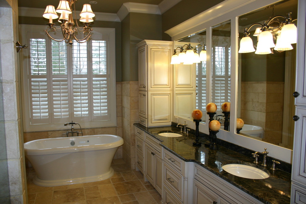 Mid-sized traditional master bathroom in Other with white cabinets, marble benchtops, a freestanding tub, a double shower, a two-piece toilet, beige tile, ceramic tile, ceramic floors, raised-panel cabinets, green walls and an undermount sink.