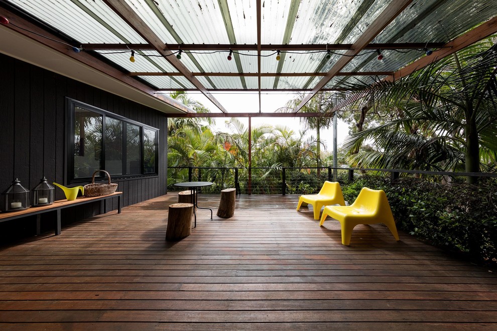 Design ideas for a mid-sized contemporary side yard deck in Sydney with a pergola.